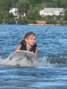 Emma Getting a Ride on the Surf Board